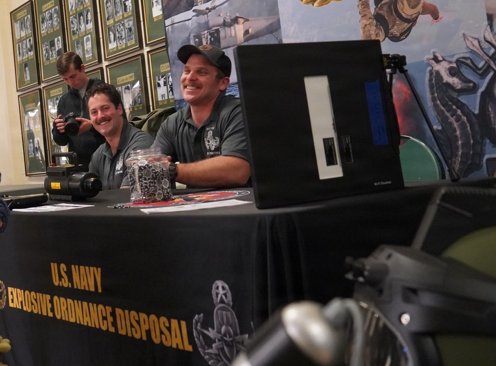 EODMU-2 Detachment Yorktown Sailors present the game ball during a men's basketball game at the College of William &amp; Mary