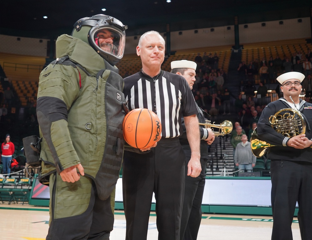 EODMU-2 Detachment Yorktown Sailors present the game ball during a men's basketball game at the College of William &amp; Mary