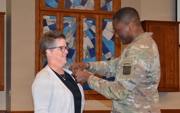 Doctrine editor receives 10-year service pin
