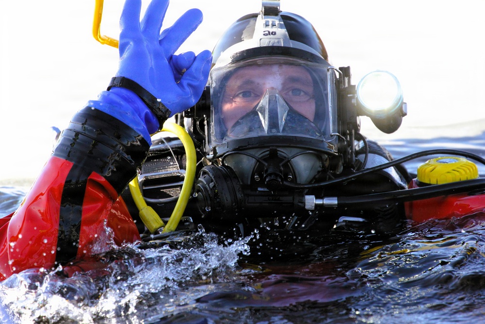 Fort McCoy DES Fire Department dive team holds February rescue training under ice