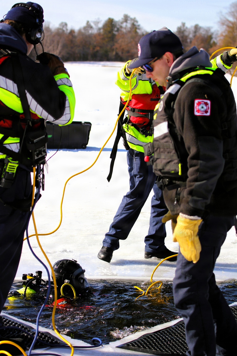 Fort McCoy DES Fire Department dive team holds February rescue training under ice