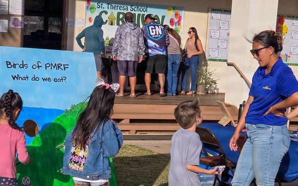 Pacific Missile Range Facility (PMRF) Volunteers at the S.T.R.E.A.M. Night at St. Theresa's Catholic School