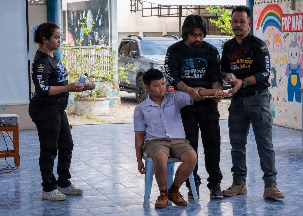 Students receive snake safety brief during Cobra Gold 45