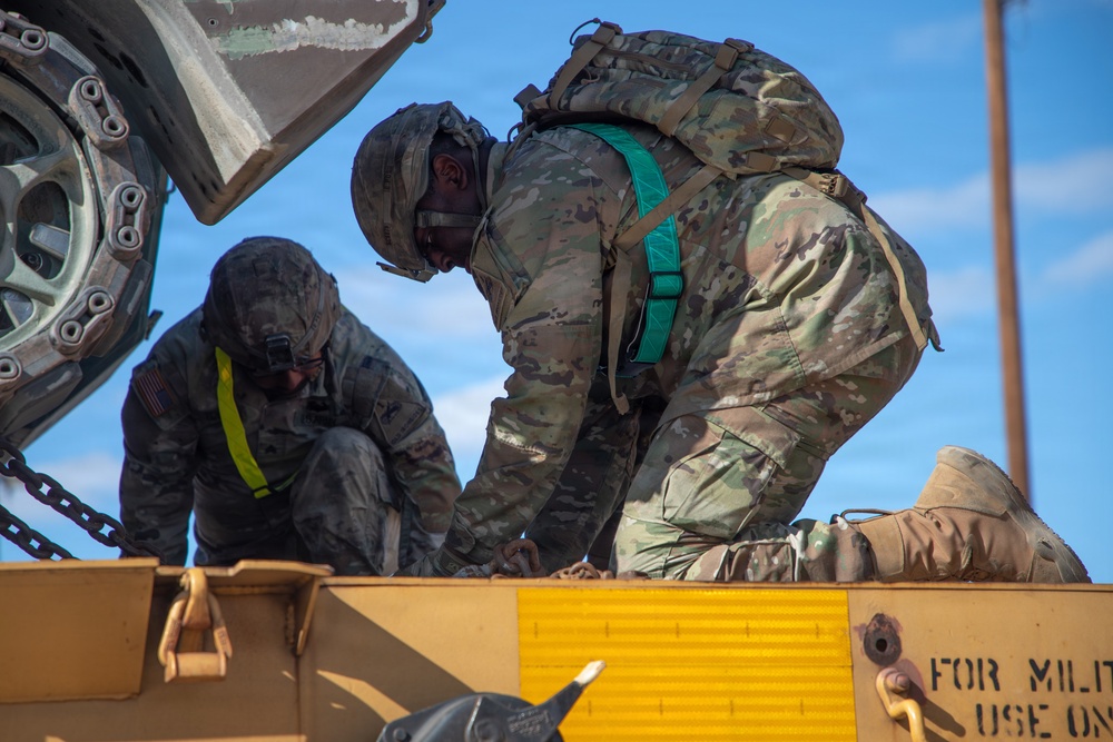 Rolling out: Iron Soldiers load armored power onto the rails