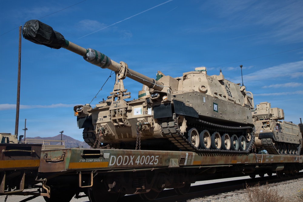 Rolling out: Iron Soldiers load armored power onto the rails