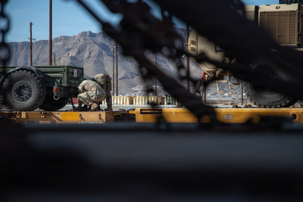 Rolling out: Iron Soldiers load armored power onto the rails
