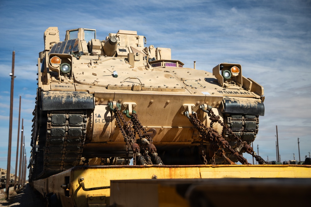 Rolling out: Iron Soldiers load armored power onto the rails
