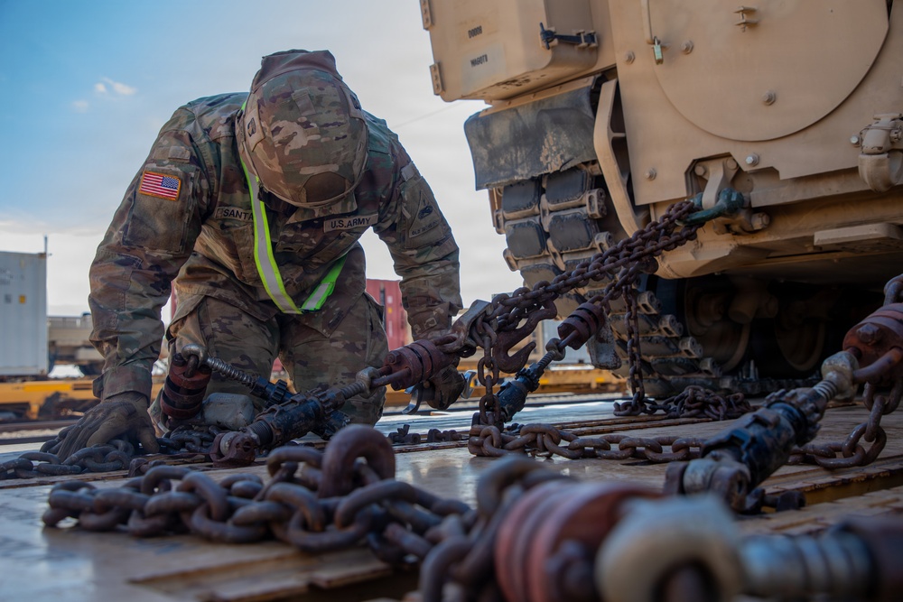 Rolling out: Iron Soldiers load armored power onto the rails