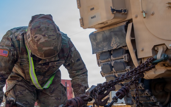 Rolling out: Iron Soldiers load armored power onto the rails