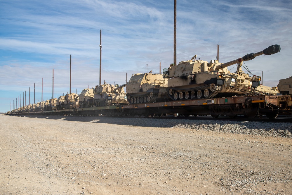 Rolling out: Iron Soldiers load armored power onto the rails