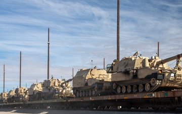 Rolling out: Iron Soldiers load armored power onto the rails