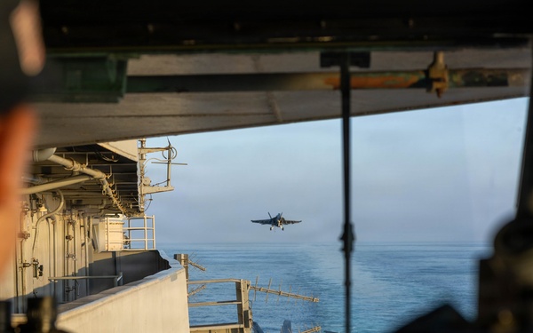 A U.S. Sailor observes flight operations in the pilothouse of Nimitz-class aircraft carrier USS Abraham Lincoln (CVN 72) in support of Operation Epic Fury, Feb. 28, 2026. (U.S. Navy photo)
