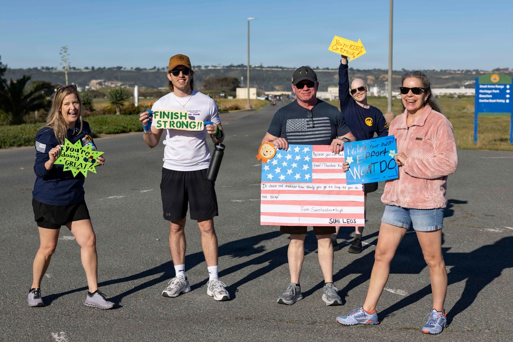 Supporters and volunteers cheer for Wounded Warriors