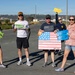 Supporters and volunteers cheer for Wounded Warriors