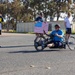 Sailors and Coast Guardsmen ride adaptive bicycles during timed trials