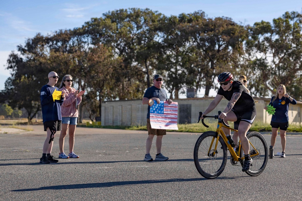Sailors and Coast Guardsmen ride adaptive bicycles during timed trials
