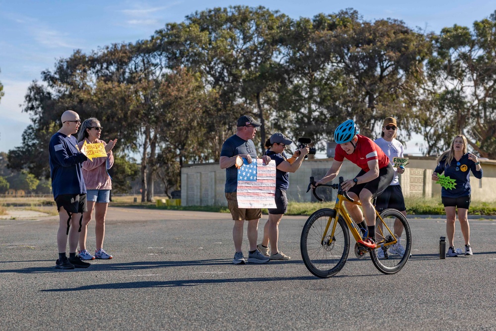 Sailors and Coast Guardsmen ride adaptive bicycles during timed trials