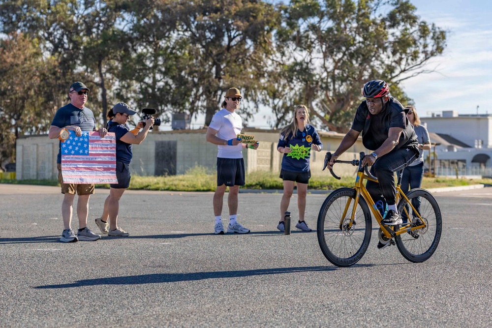 Sailors and Coast Guardsmen ride adaptive bicycles during timed trials