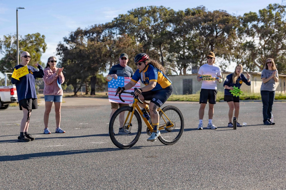 Sailors and Coast Guardsmen ride adaptive bicycles during timed trials
