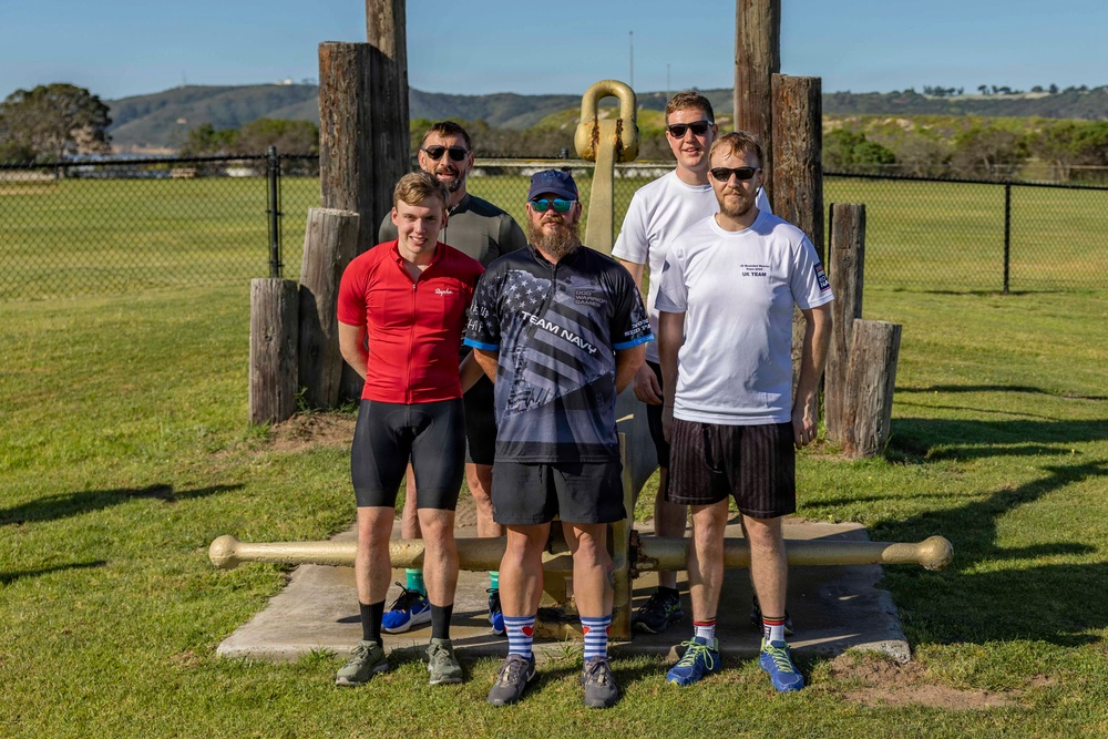 Sailors and Coast Guardsmen ride adaptive bicycles during timed trials