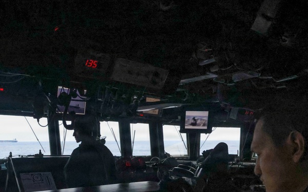 USS Paul Ignatius (DDG 117) works with the U.S. Coast Guard in the interdiction of the M/T Bella 1