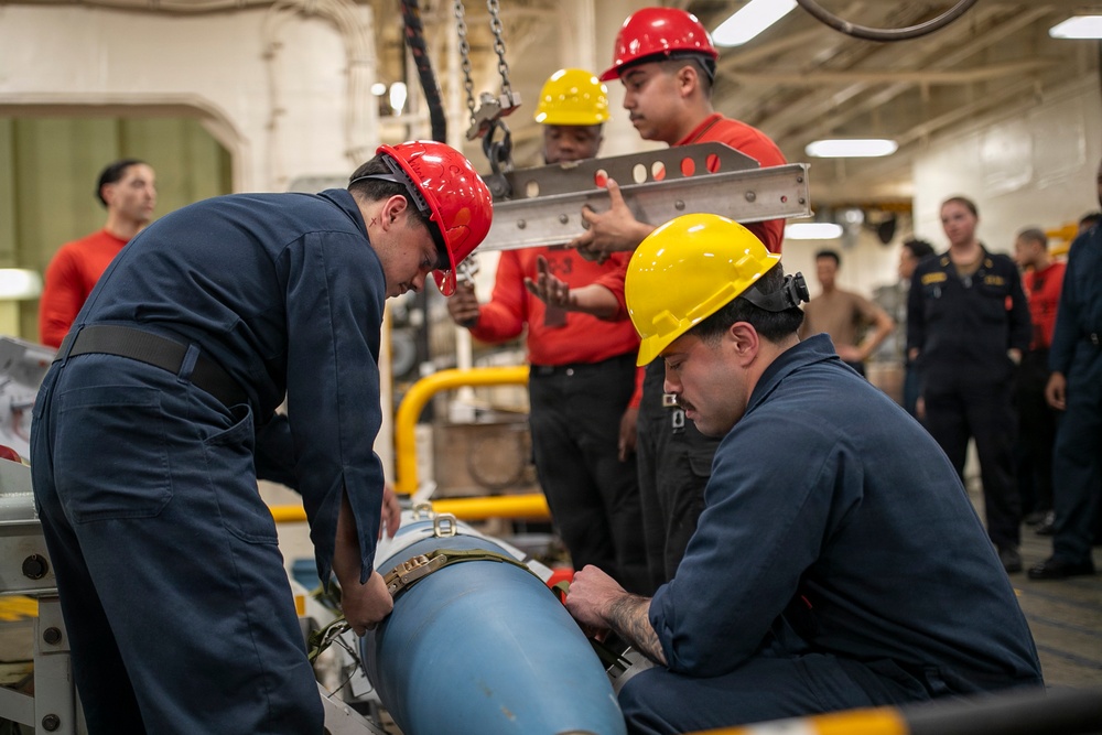 USS Tripoli Sailors Assemble Ordnance