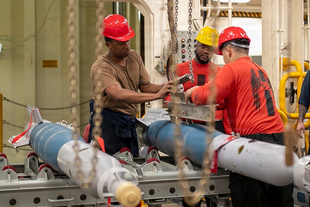USS Tripoli Sailors Assemble Ordnance