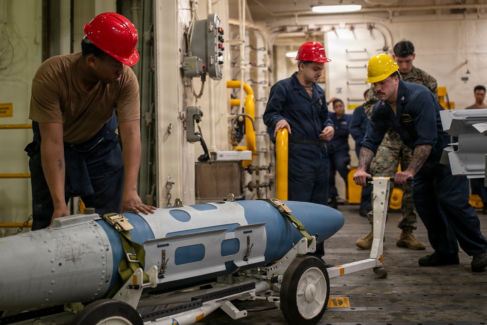USS Tripoli Sailors Assemble Ordnance