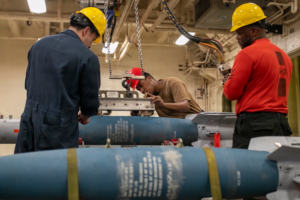 USS Tripoli Sailors Assemble Ordnance