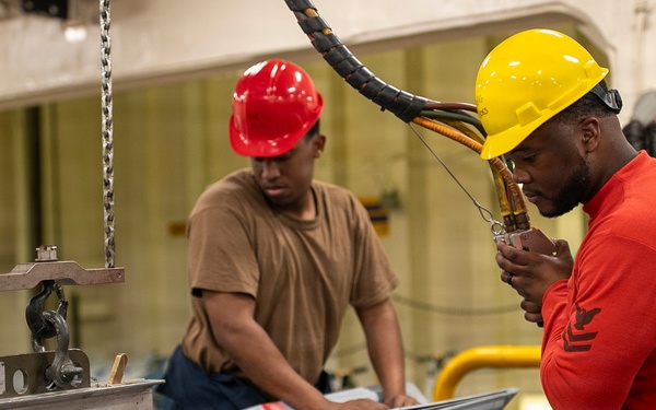USS Tripoli Sailors Assemble Ordnance