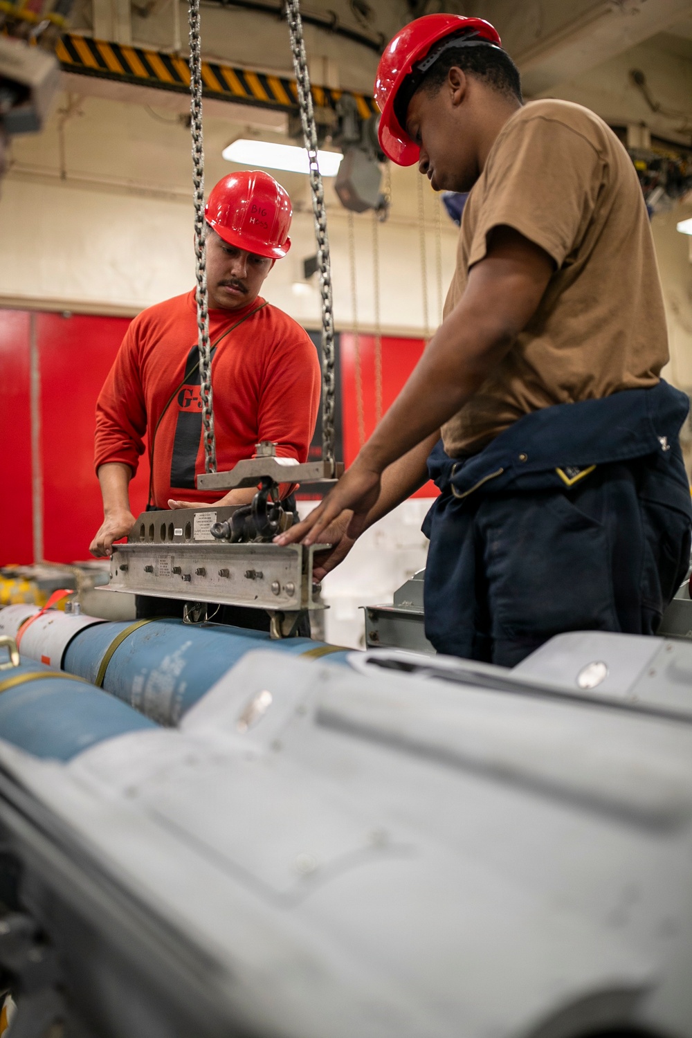 USS Tripoli Sailors Assemble Ordnance