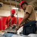USS Tripoli Sailors Assemble Ordnance