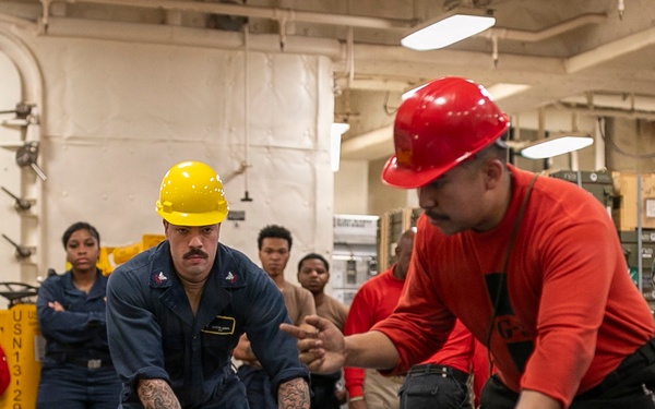 USS Tripoli Sailors Assemble Ordnance