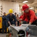 USS Tripoli Sailors Assemble Ordnance