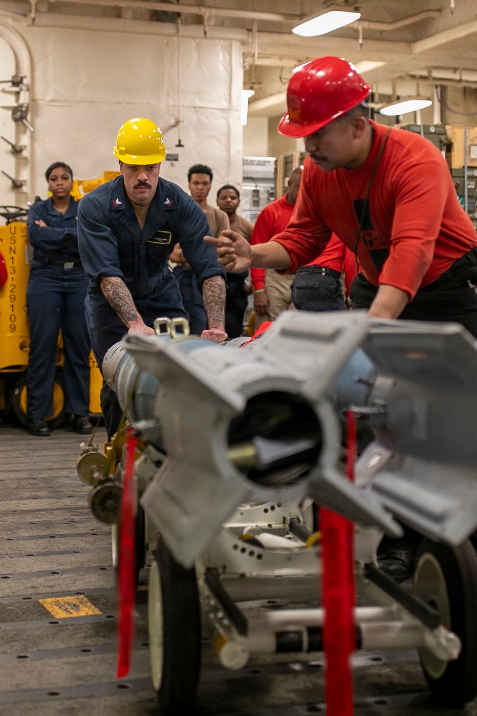 USS Tripoli Sailors Assemble Ordnance