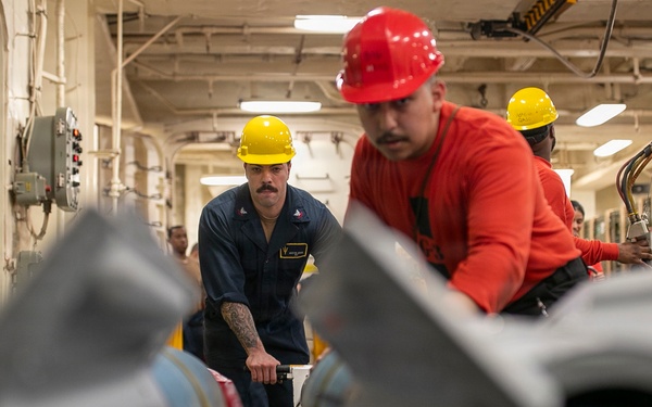 USS Tripoli Sailors Assemble Ordnance