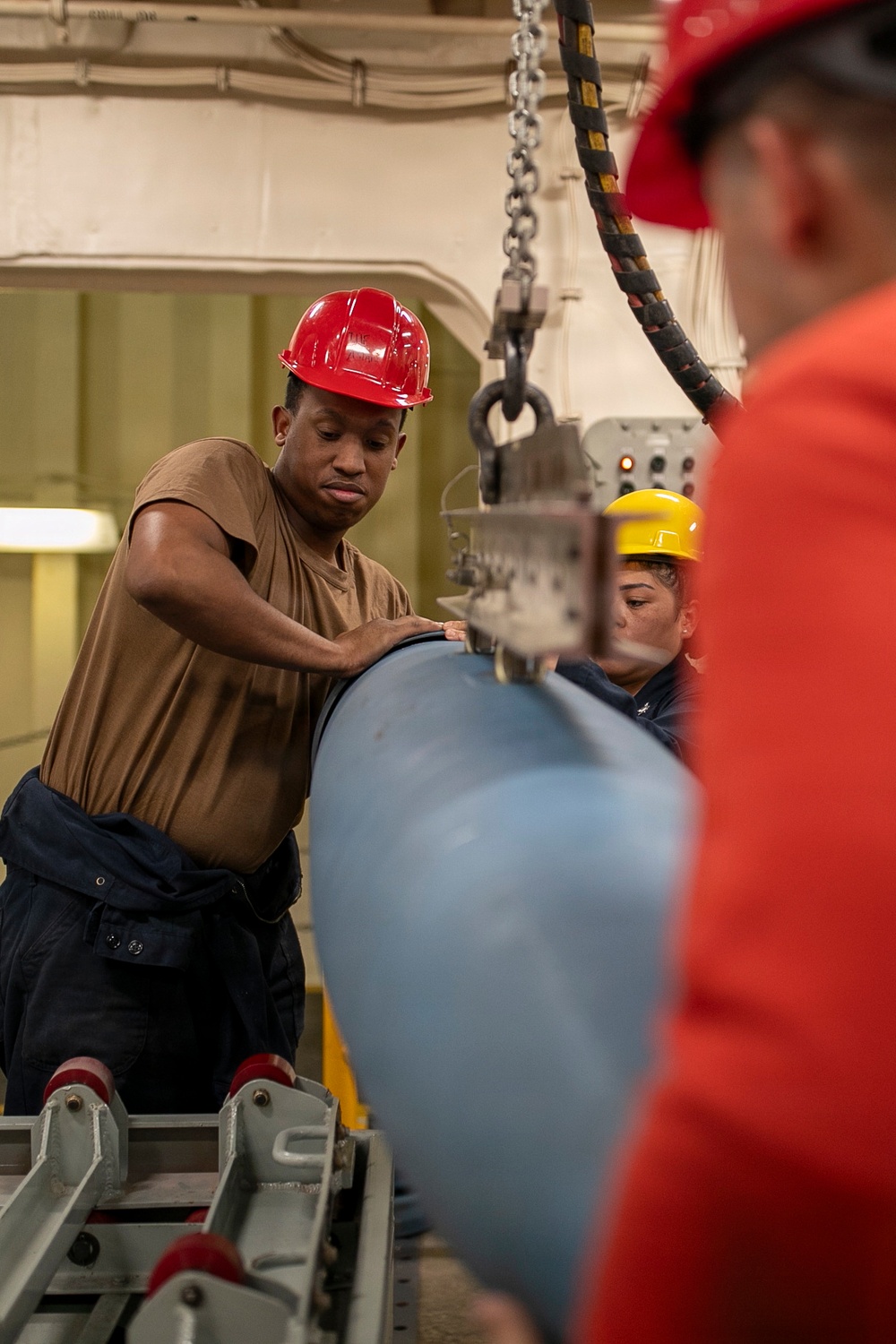 USS Tripoli Sailors Assemble Ordnance