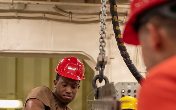 USS Tripoli Sailors Assemble Ordnance