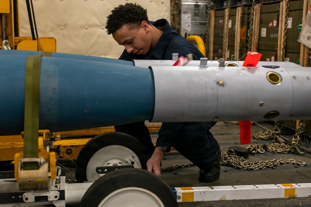 USS Tripoli Sailors Assemble Ordnance