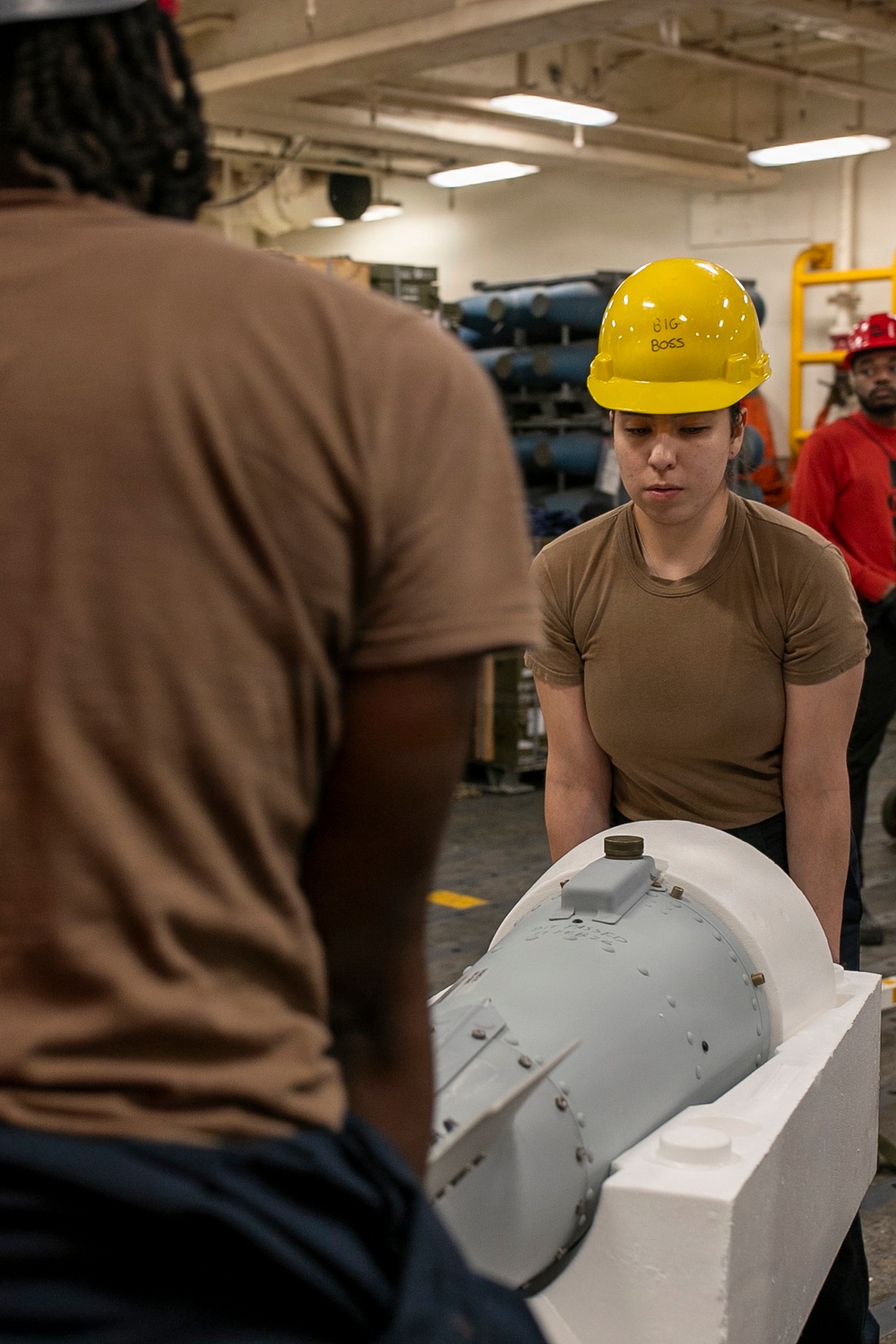 USS Tripoli Sailors Assemble Ordnance