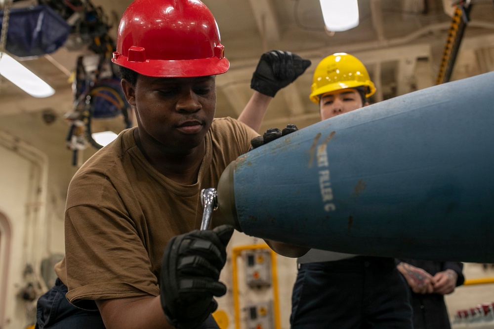 USS Tripoli Sailors Assemble Ordnance