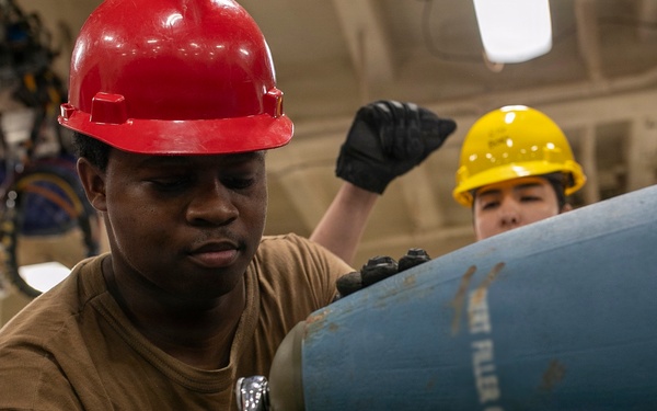 USS Tripoli Sailors Assemble Ordnance