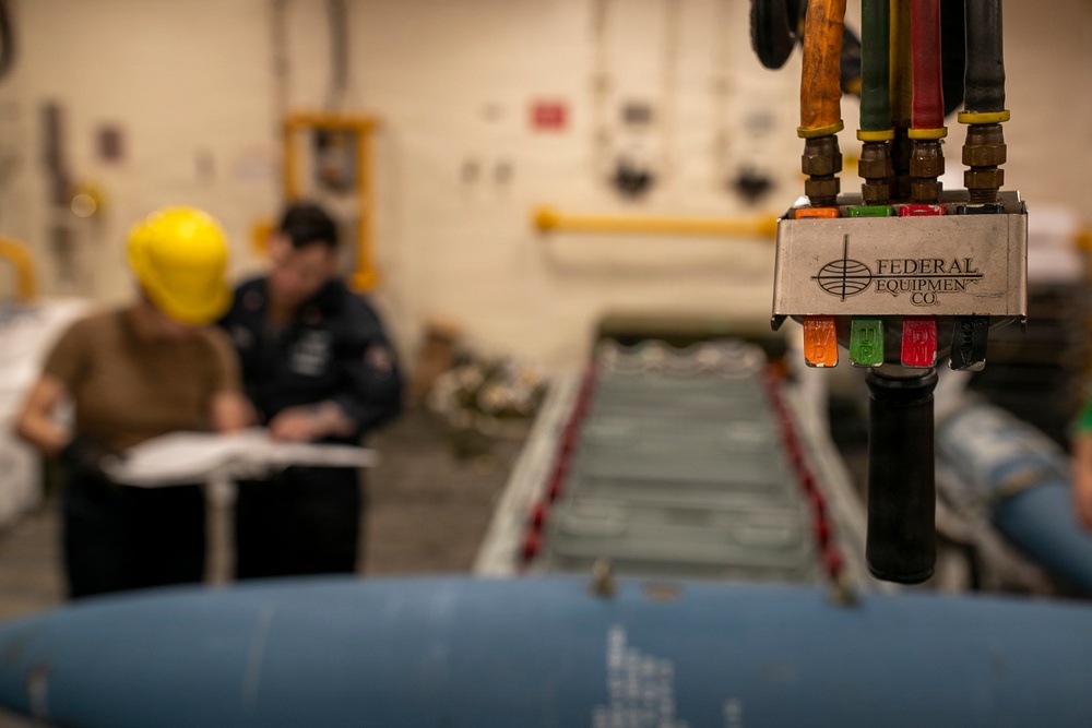 USS Tripoli Sailors Assemble Ordnance