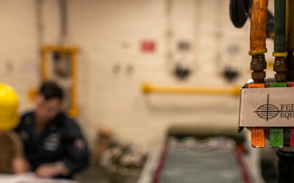 USS Tripoli Sailors Assemble Ordnance