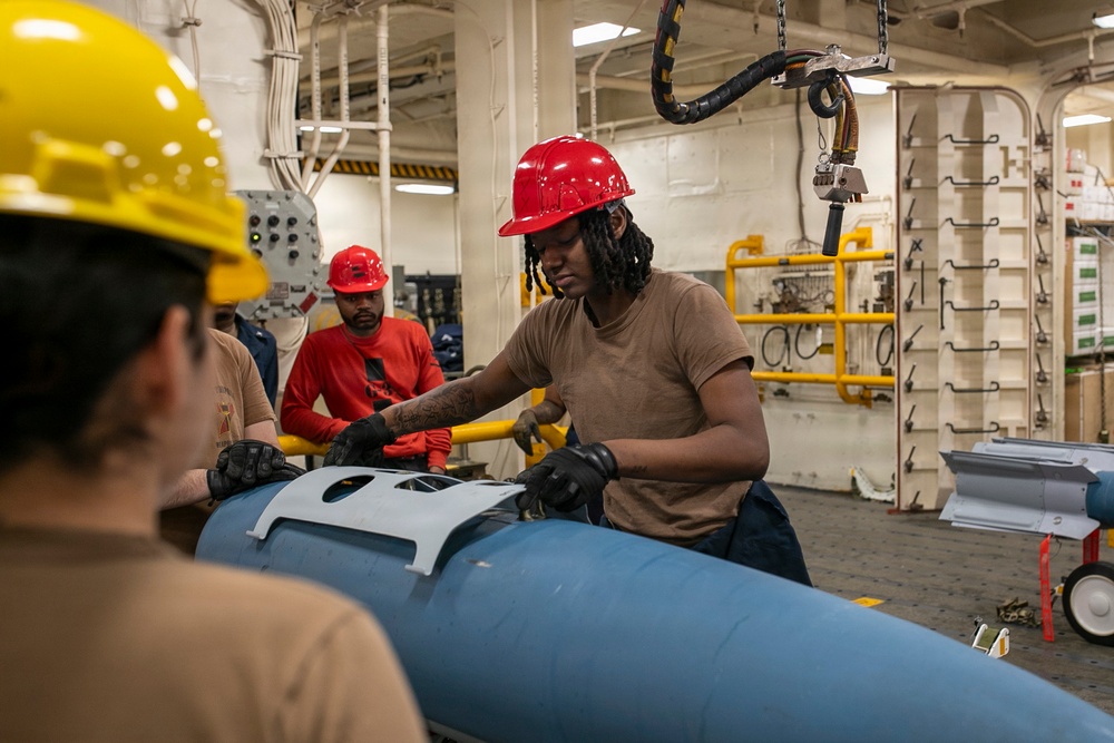 USS Tripoli Sailors Assemble Ordnance