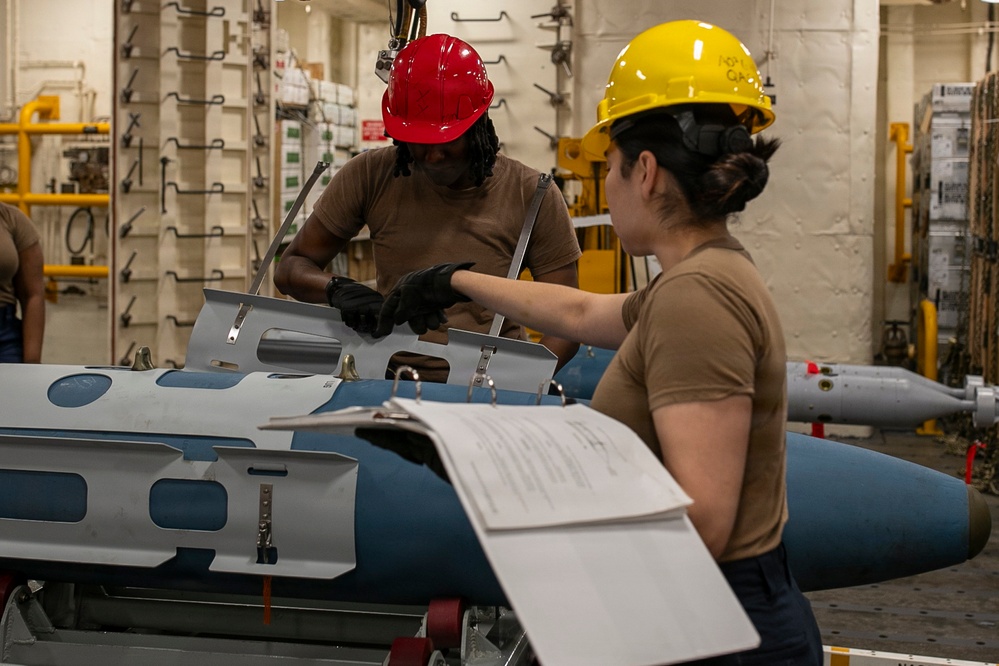 USS Tripoli Sailors Assemble Ordnance
