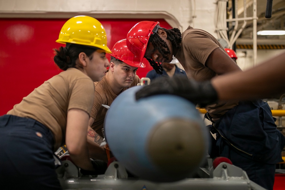 USS Tripoli Sailors Assemble Ordnance