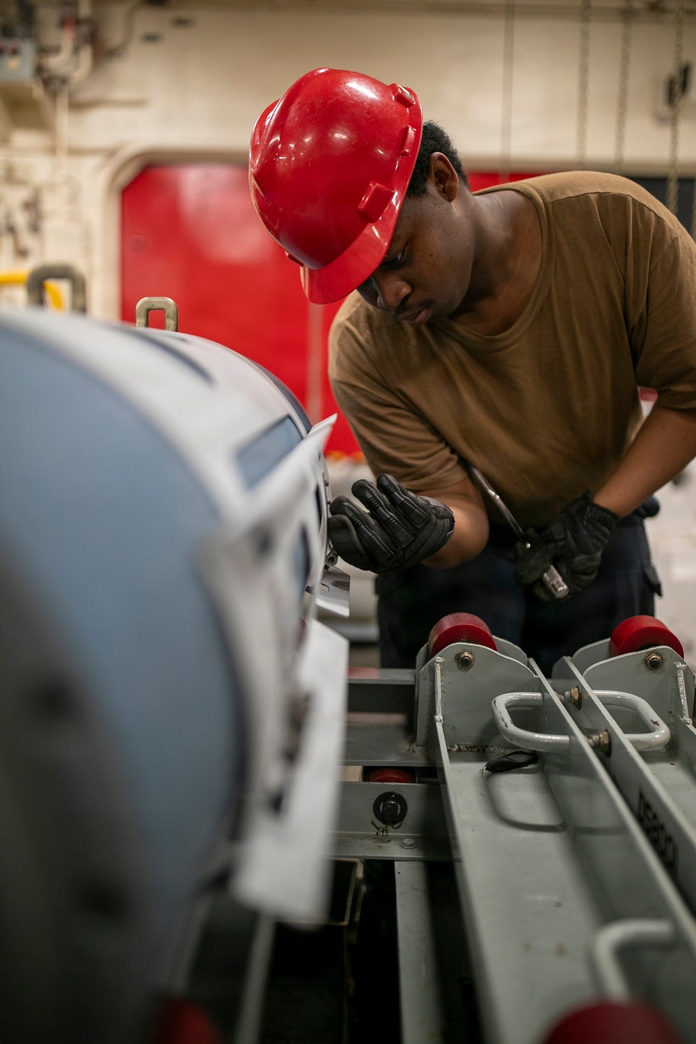 USS Tripoli Sailors Assemble Ordnance