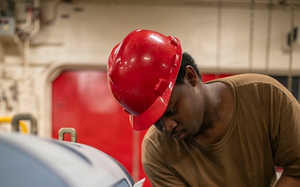 USS Tripoli Sailors Assemble Ordnance