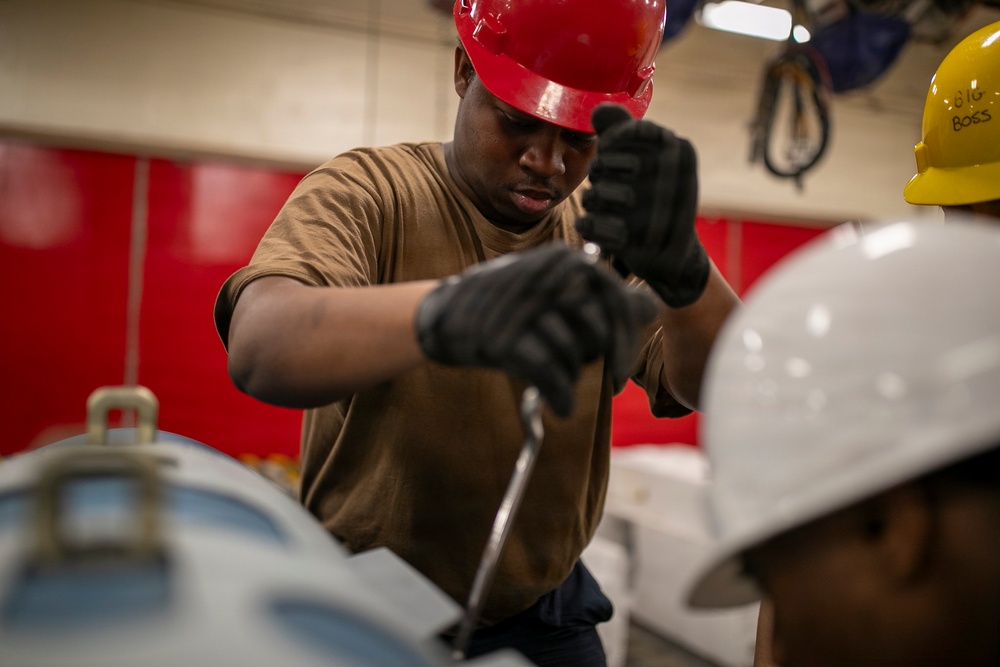 USS Tripoli Sailors Assemble Ordnance